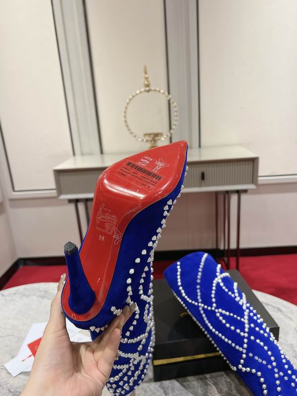 Women's blue suede stiletto boots with crystal embellishments