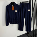 Navy blue zip-up jacket and pants set