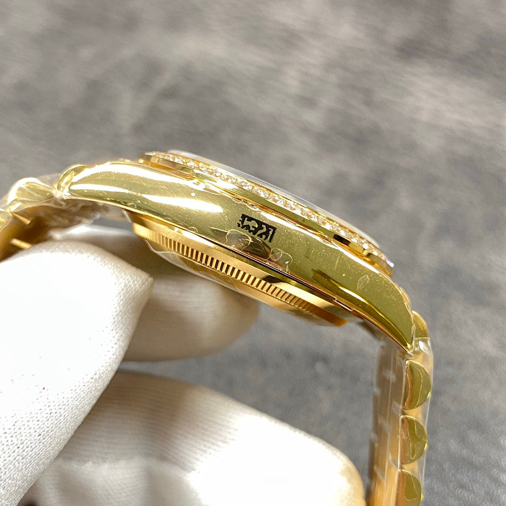 Automatic 36mm watch with green and gold dial