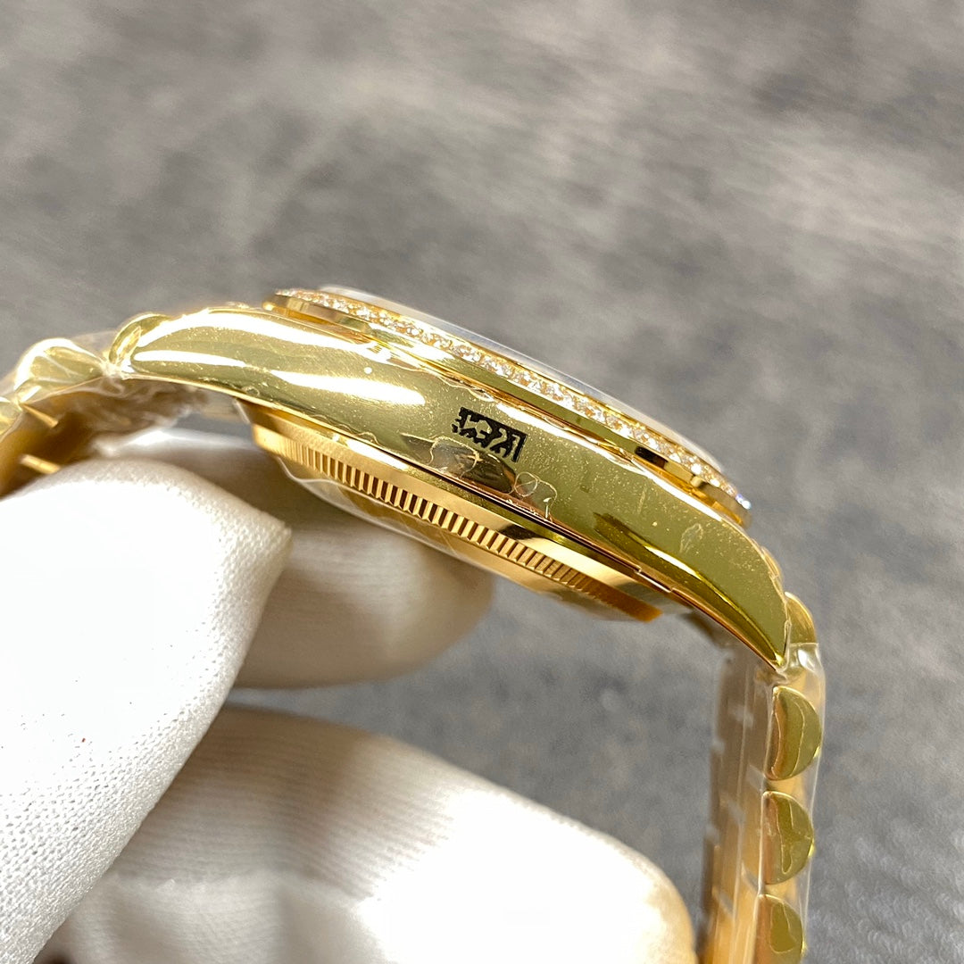 Automatic 36mm watch with green and gold dial