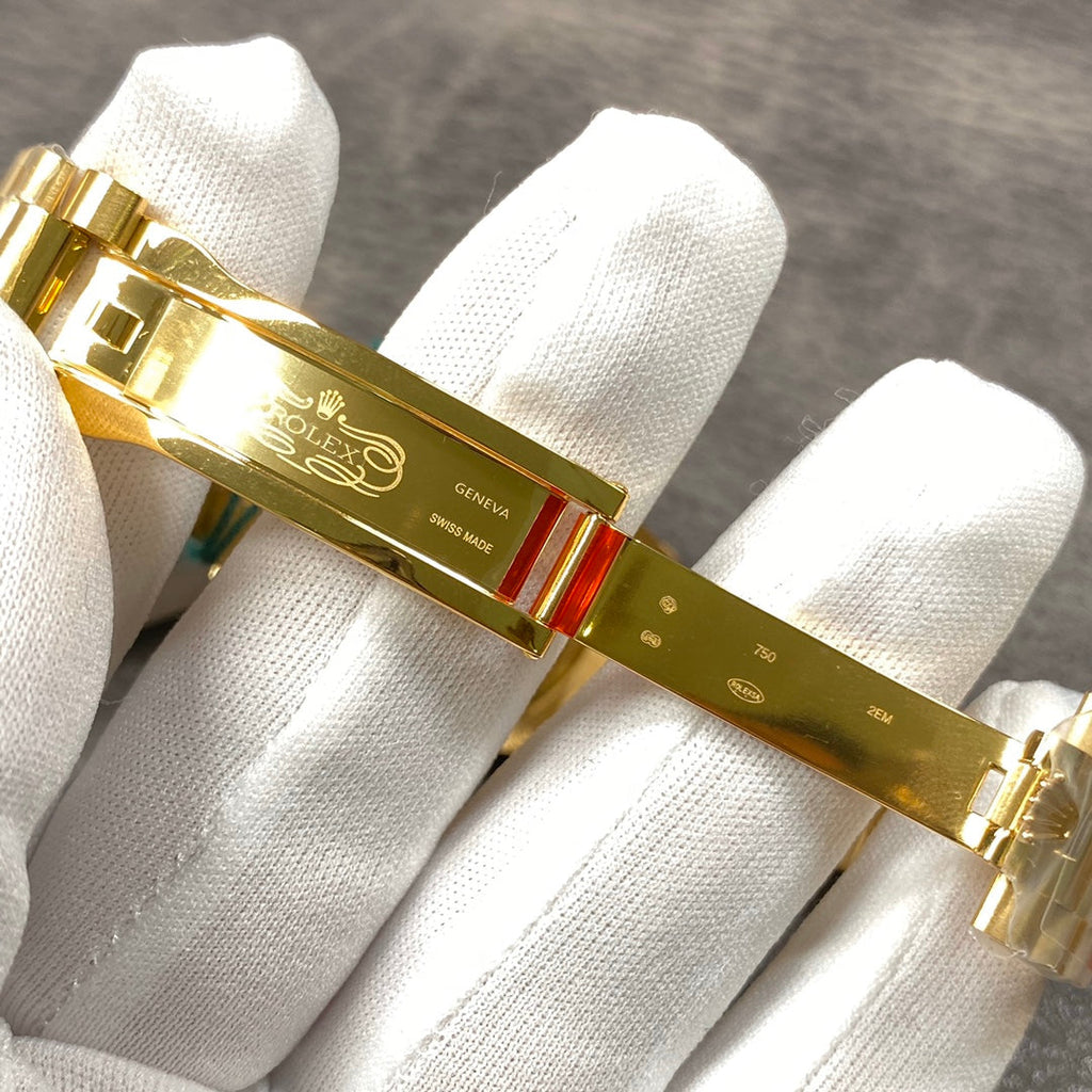 Automatic 36mm watch with green and gold dial