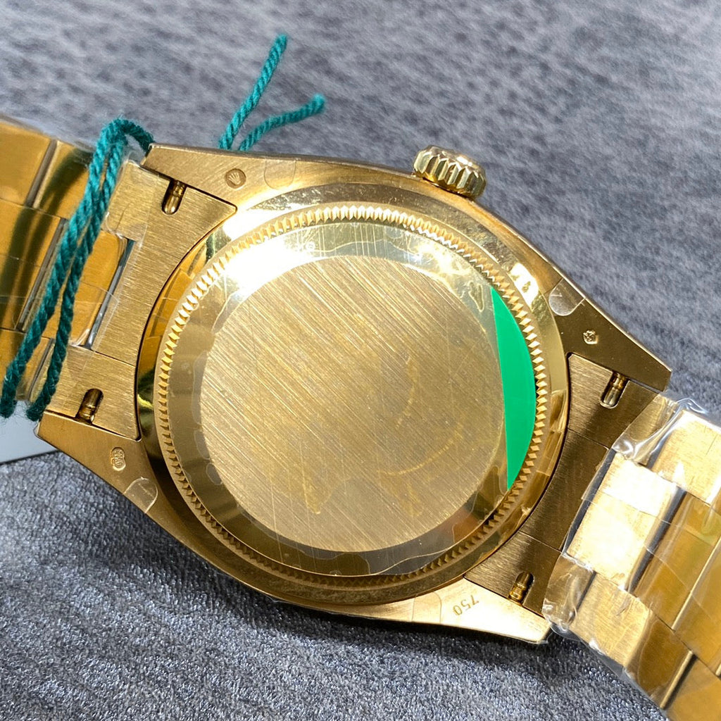 Automatic 36mm watch with green and gold dial
