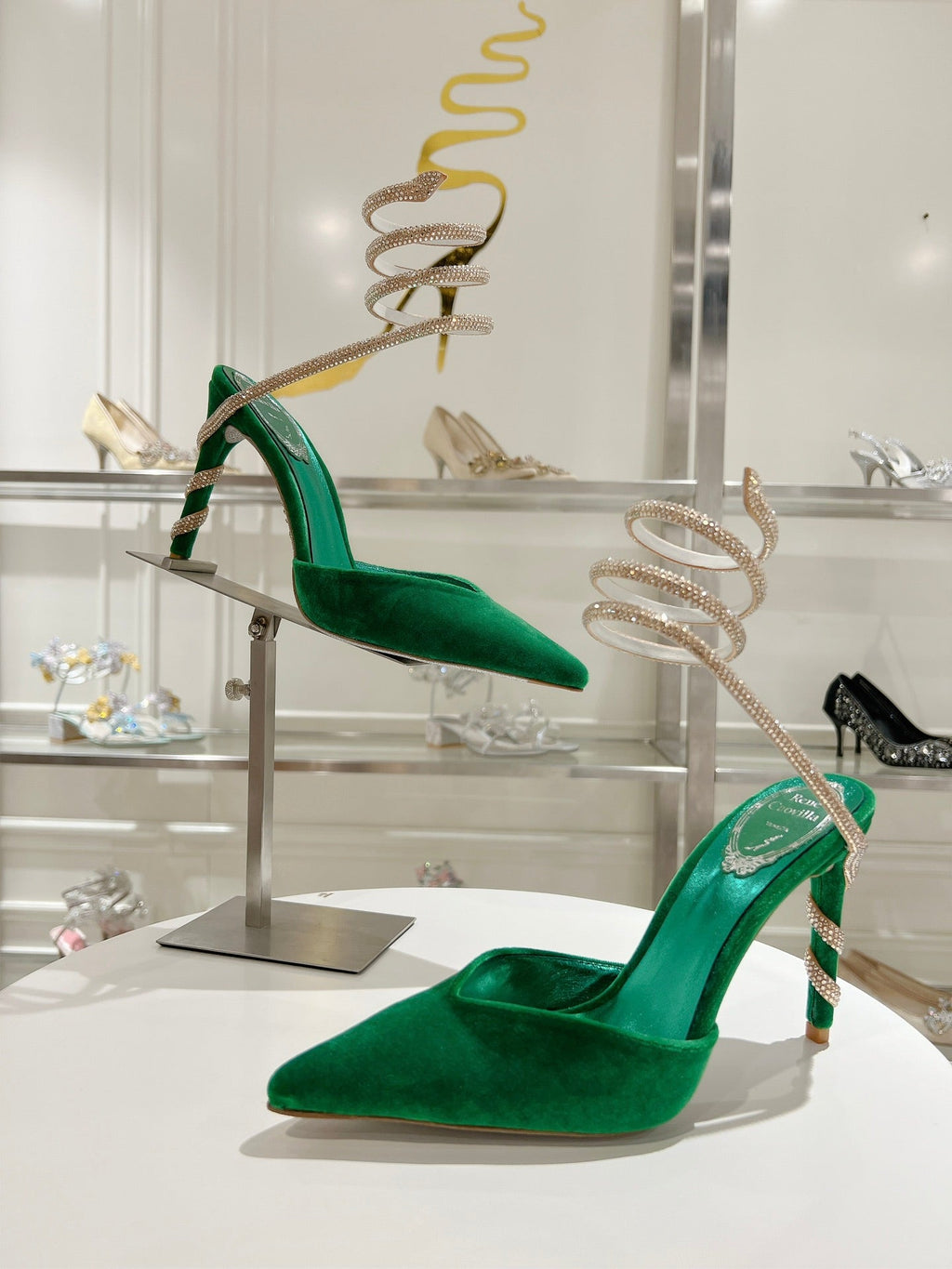 Cleo Pumps mit Schlangenmuster