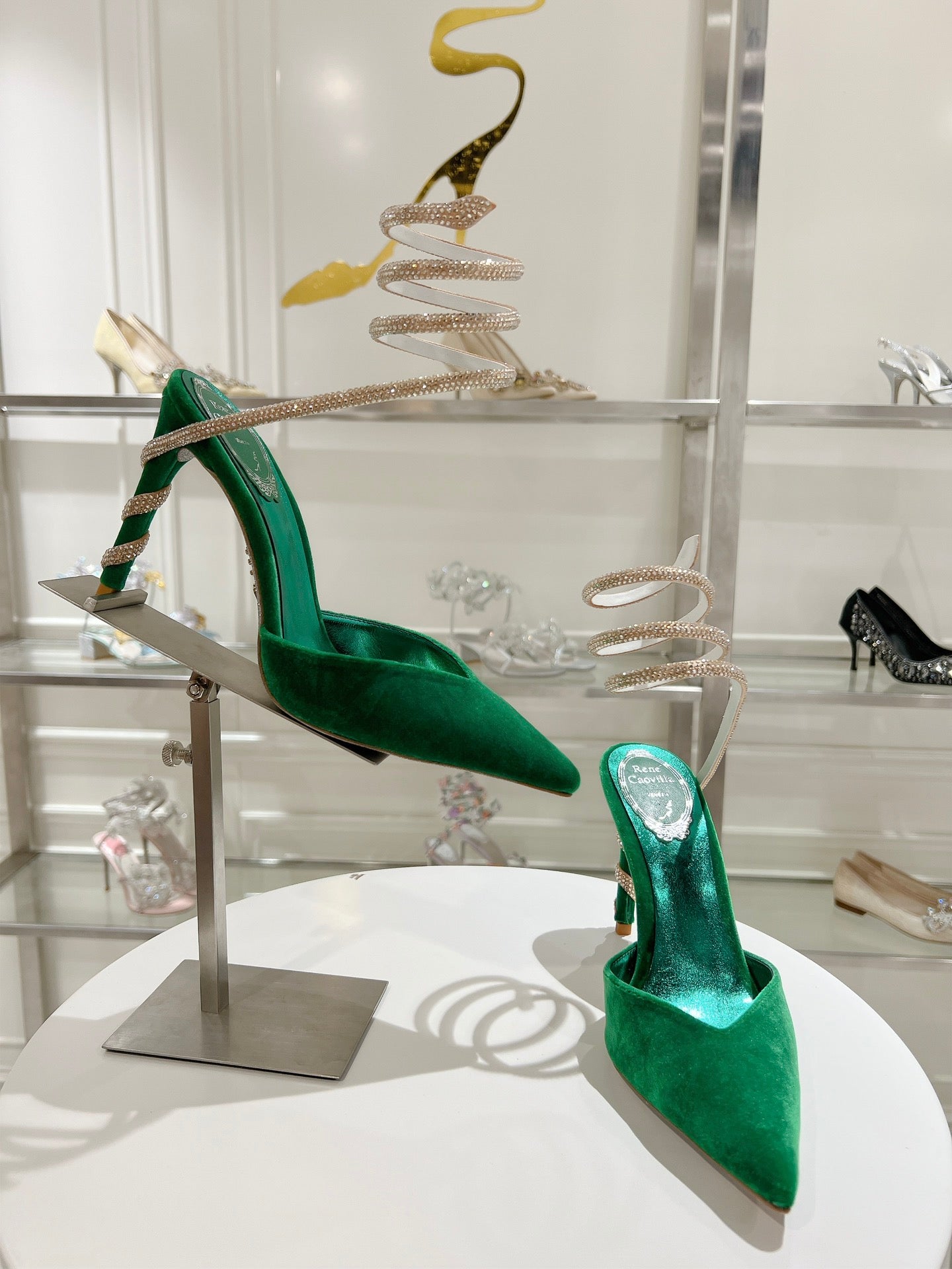 Cleo Pumps mit Schlangenmuster