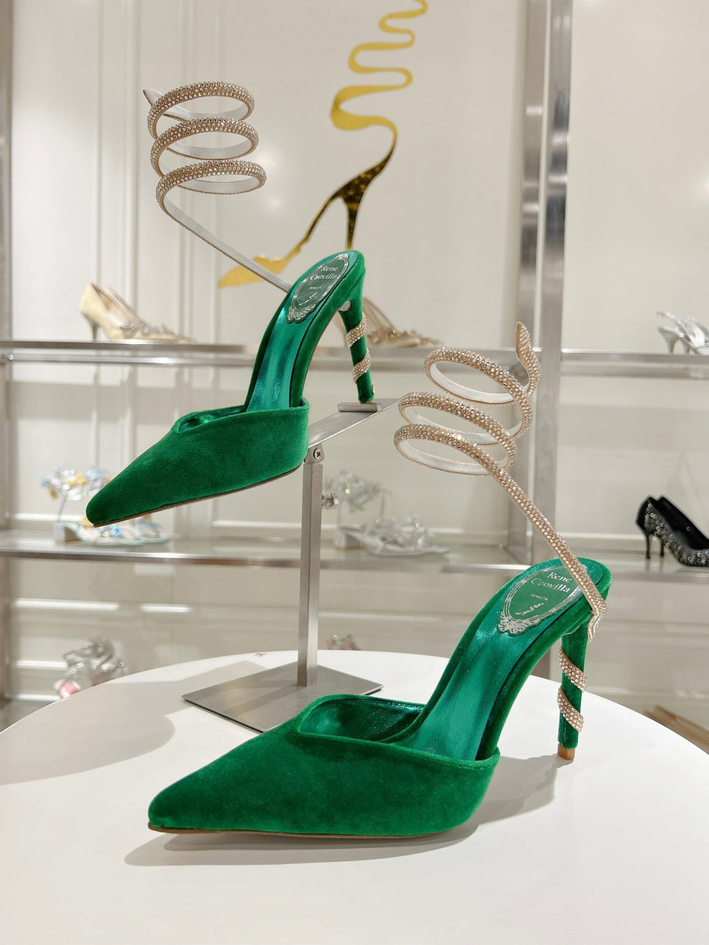 Cleo Pumps mit Schlangenmuster