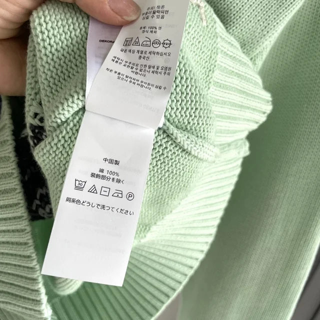 Mintgrüner Golf-Bärenpullover