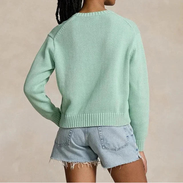 Mintgrüner Golf-Bärenpullover