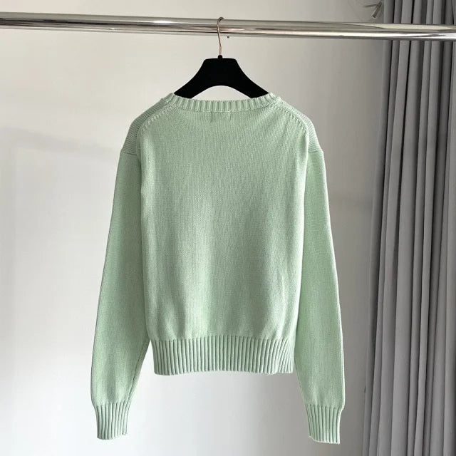 Mintgrüner Golf-Bärenpullover