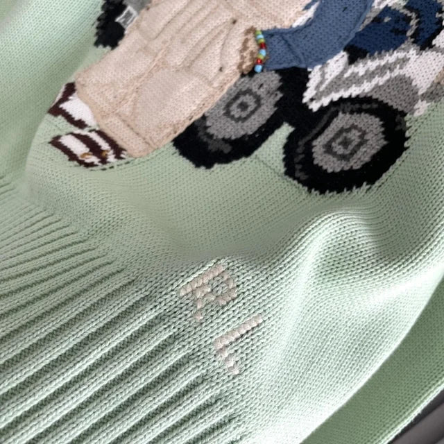 Mintgrüner Golf-Bärenpullover
