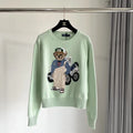 Mintgrüner Golf-Bärenpullover